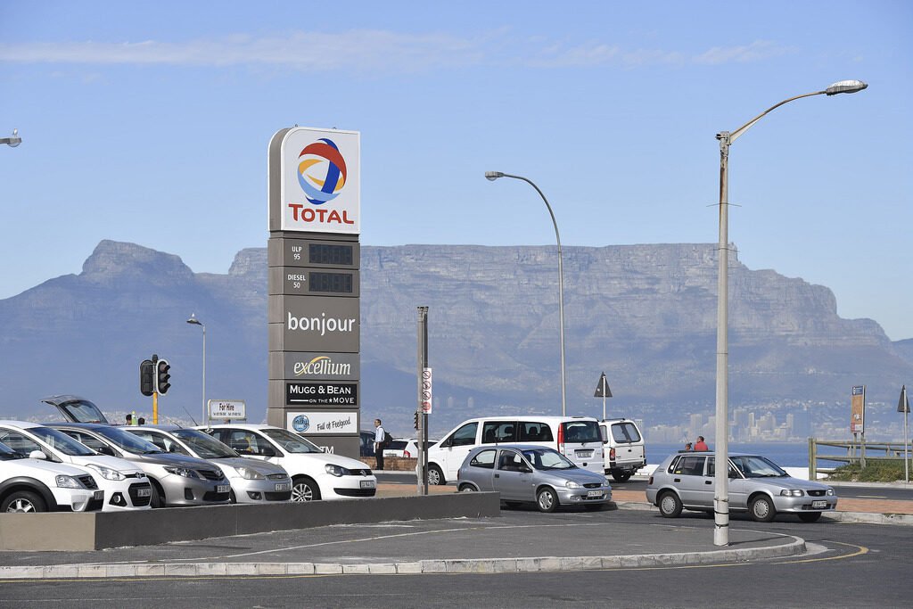 Sign for a Total gasoline station near a road