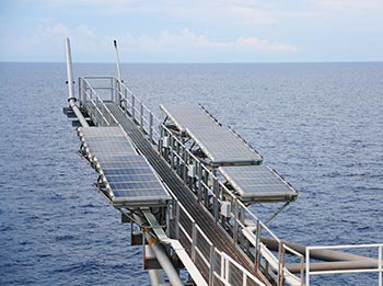 Solar panels generate energy on an offshore facility